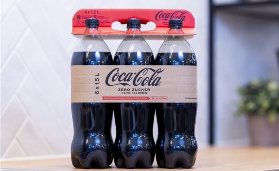 a photo of coca cola bottles with high-strength paper sleeve that replaces plastic shrink wrap