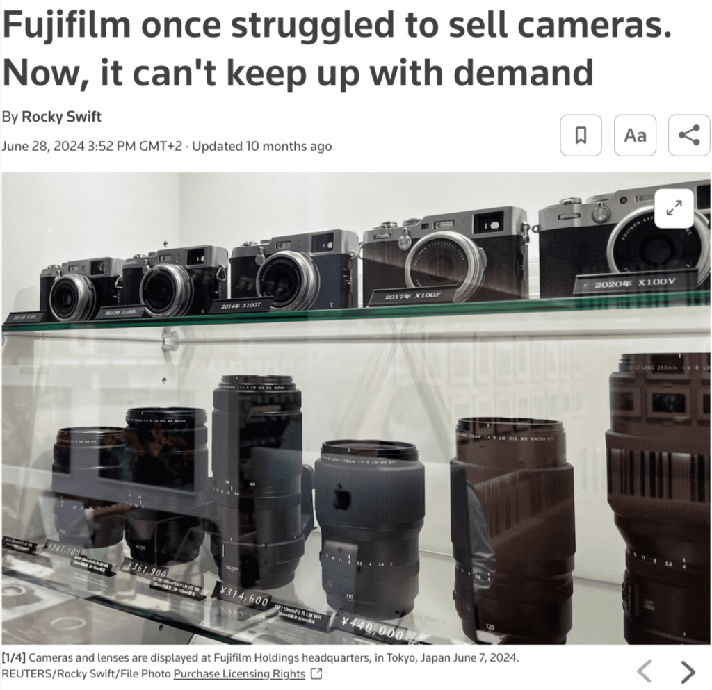 Display of Fujifilm cameras and lenses at company headquarters in Tokyo, reflecting rising consumer demand