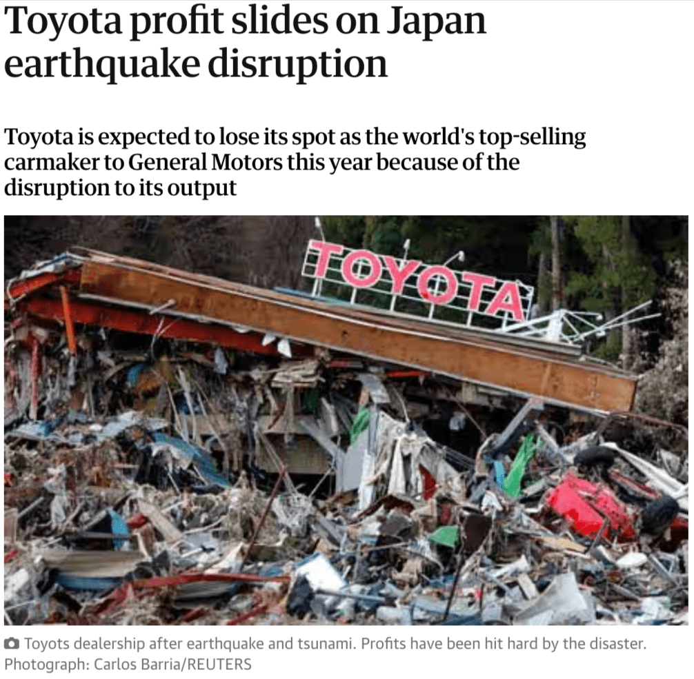 Collapsed Toyota dealership building surrounded by rubble after a Japan earthquake and tsunami